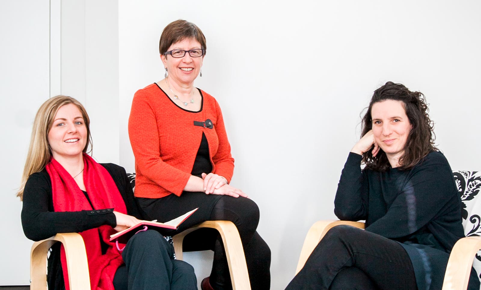 Abi, Kersten and Wendy sit as a group